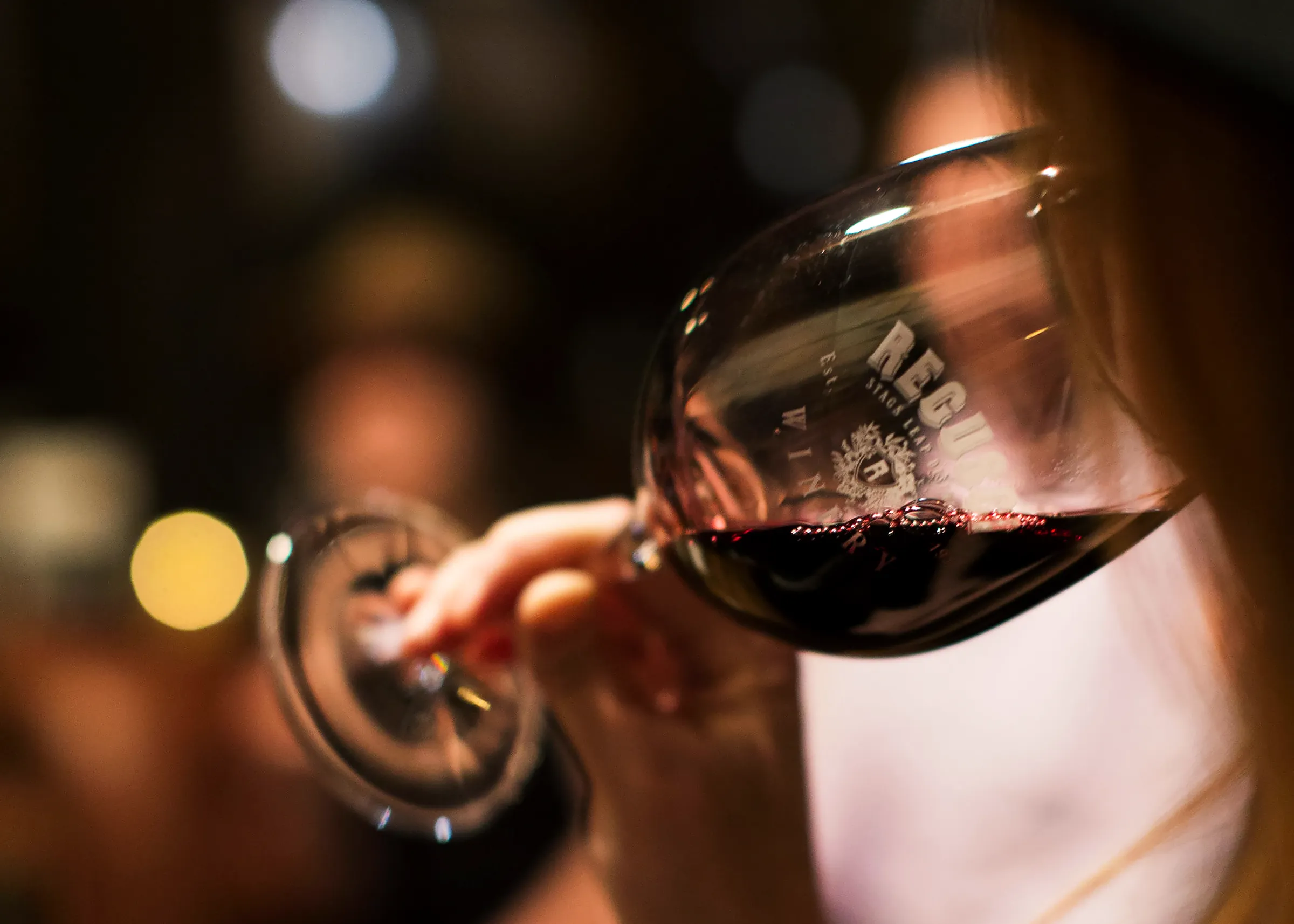 Person Drinking Regusci Wine