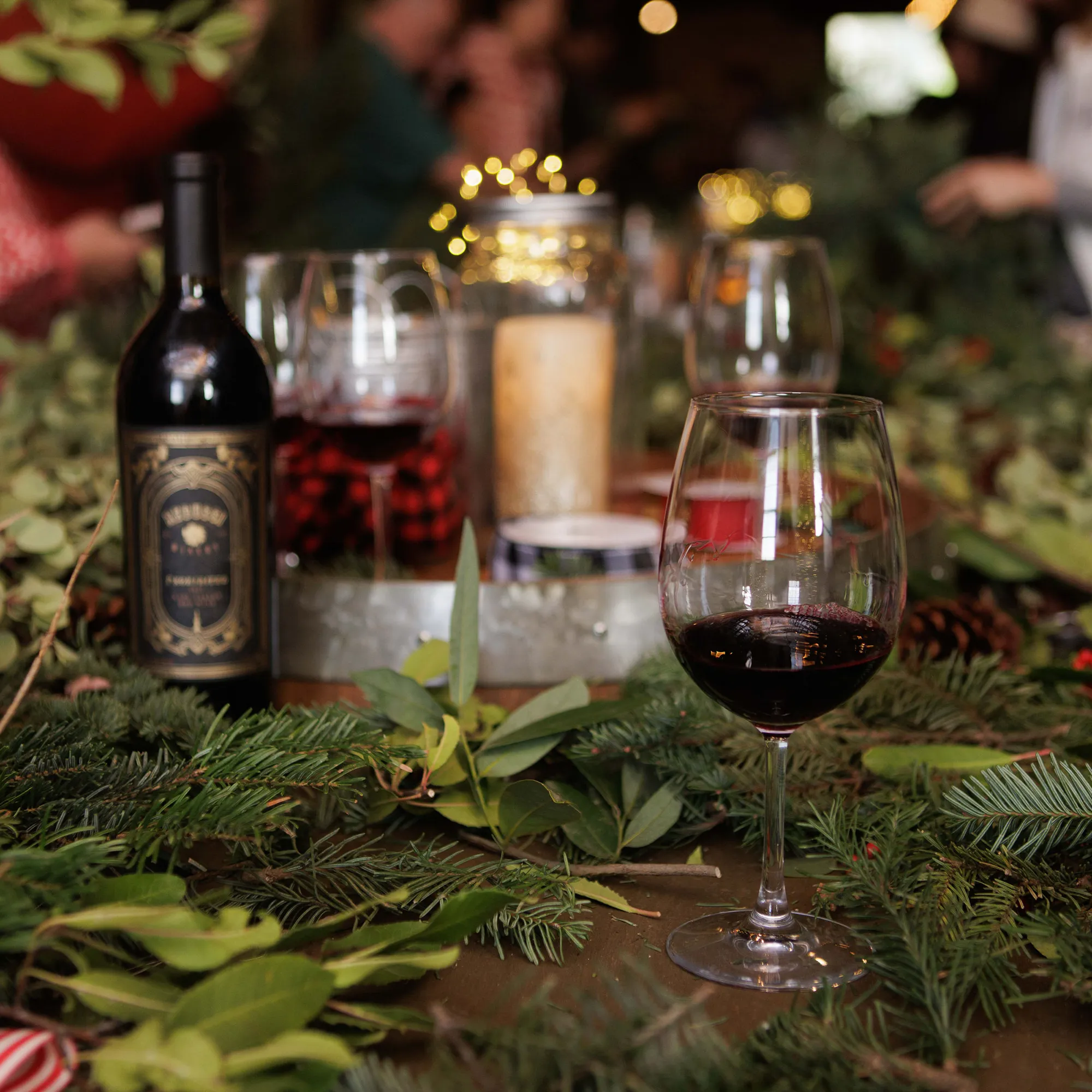 Wine bottle and glass on wreath decoration
