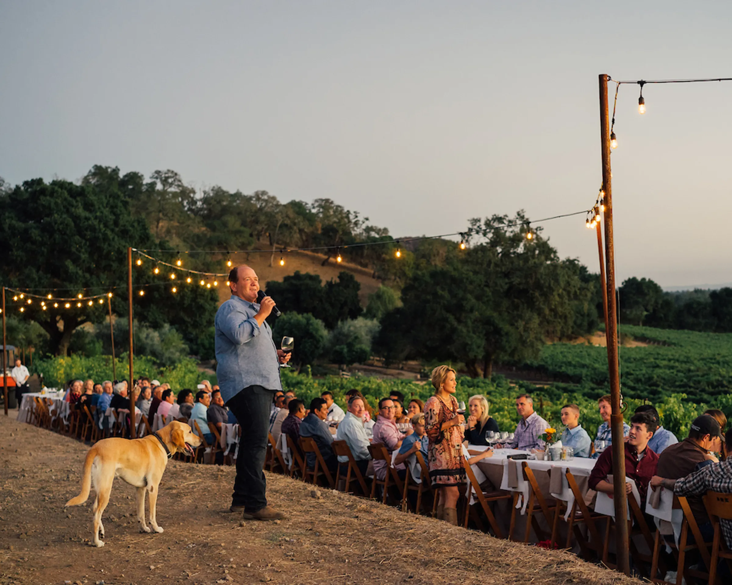 Jim Regusci speaking on stage at an event
